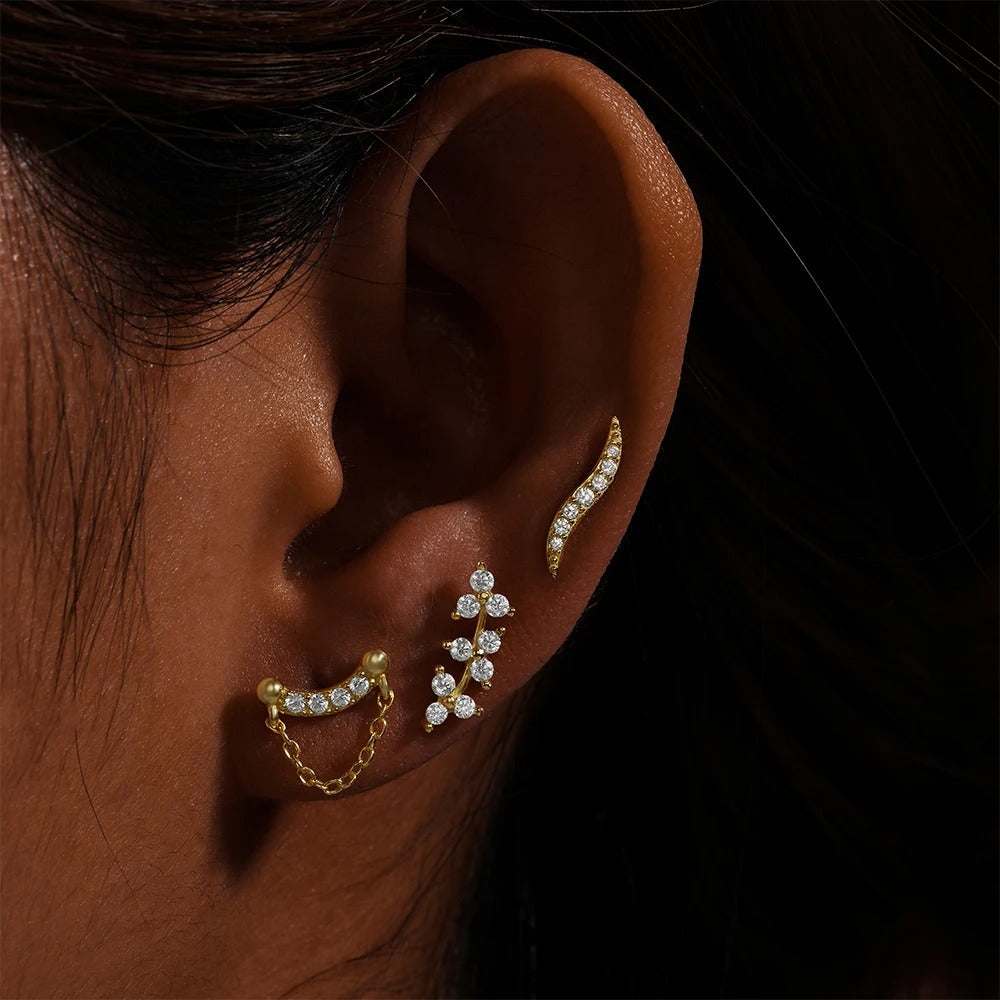 Judith, un piercing lóbulo donde cada circonita cuenta una historia de resplandor