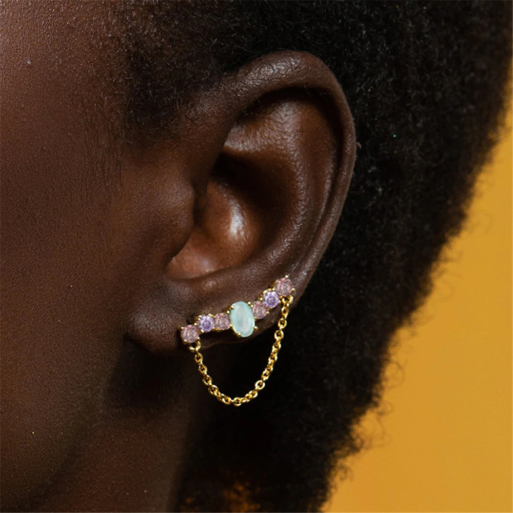 Pendientes violetas y piedra azul en barra curvada de plata