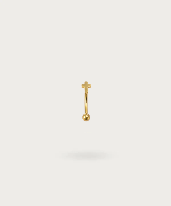 piercing banana rook en forma de cruz