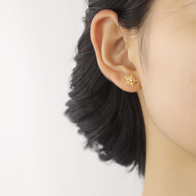 piercing oreja mujer copo de nieve
