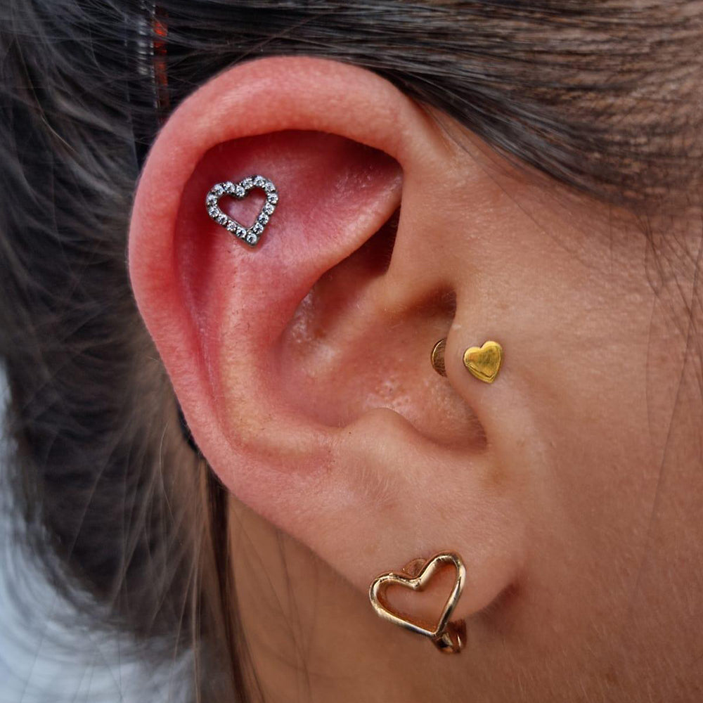 piercing corazon oreja mujer