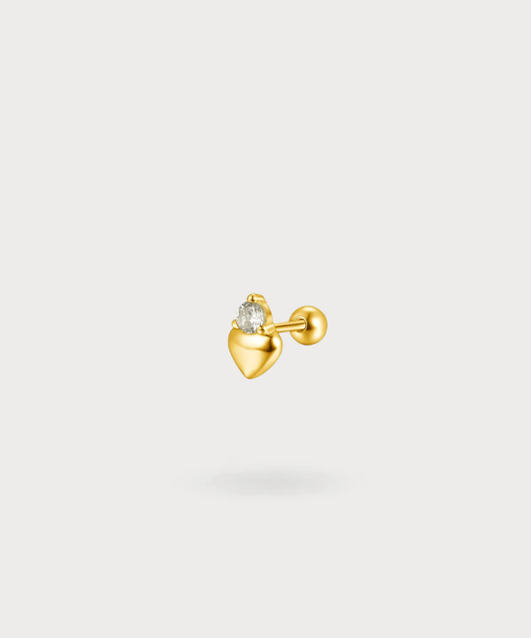 Piercing flat Maya en forma de corazón con circonio brillante en oro, una pieza única y delicada.

