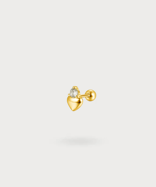Piercing flat Maya en forma de corazón con circonio brillante en oro, una pieza única y delicada.


